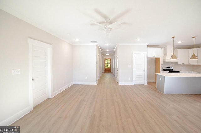 unfurnished living room with ceiling fan, light hardwood / wood-style floors, and ornamental molding