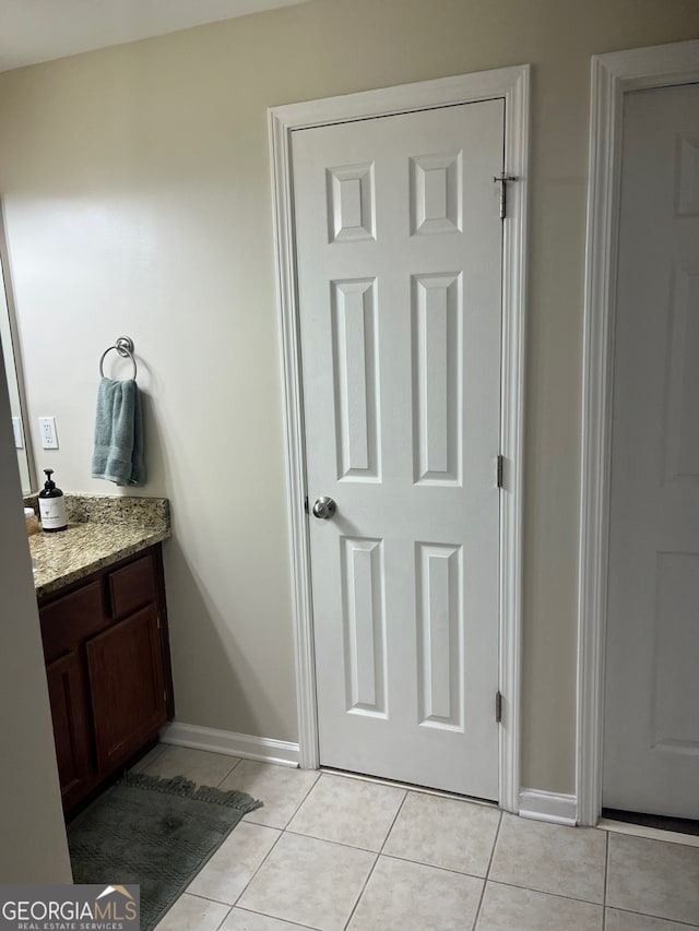 bathroom with vanity and tile patterned floors