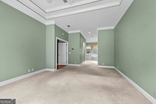 carpeted empty room featuring ornamental molding, ceiling fan, and a textured ceiling