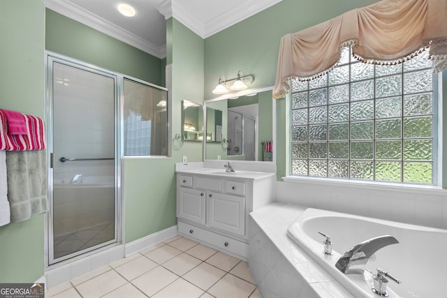 bathroom with a healthy amount of sunlight, independent shower and bath, vanity, and tile patterned floors