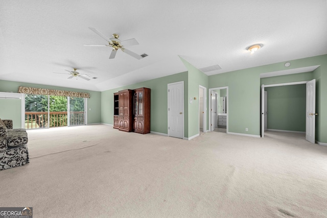 unfurnished living room with light carpet and ceiling fan