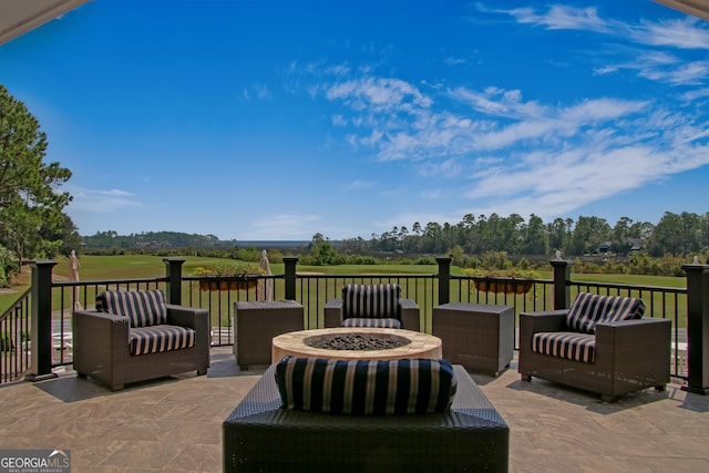 view of patio / terrace featuring an outdoor living space with a fire pit