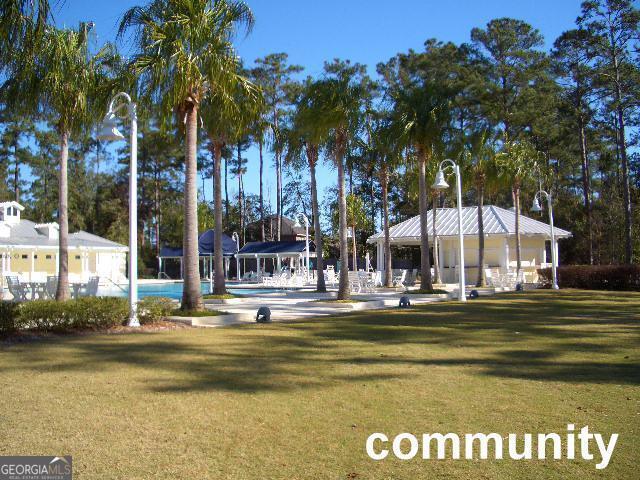 view of property's community featuring a gazebo and a lawn