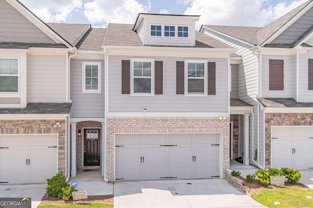 view of front of property with a garage