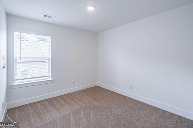 spare room with carpet flooring