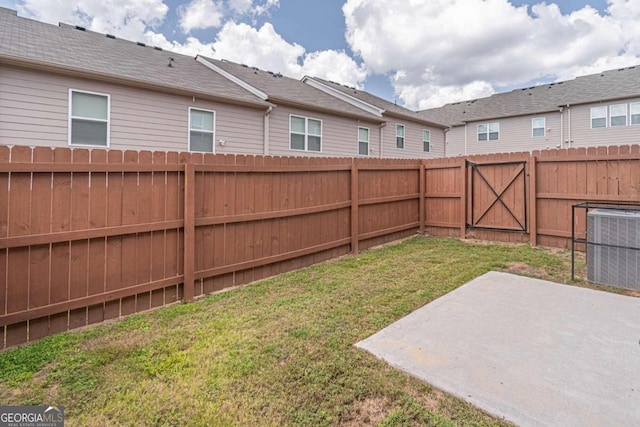 view of yard with a patio area and central AC