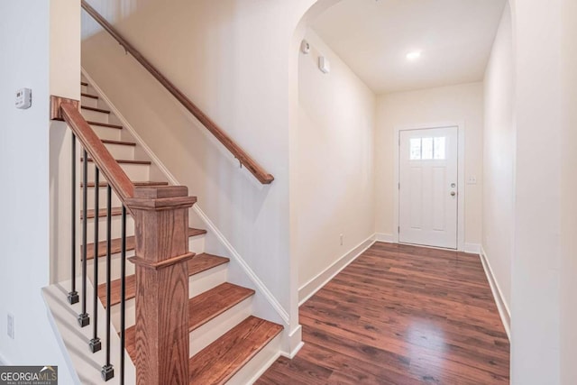 foyer entrance with dark wood-type flooring