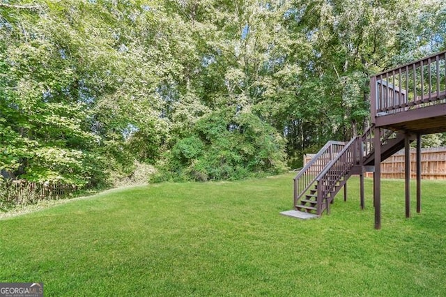 view of yard featuring a wooden deck