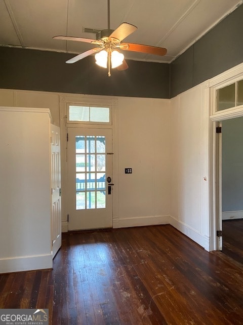 doorway to outside with ceiling fan and dark hardwood / wood-style floors