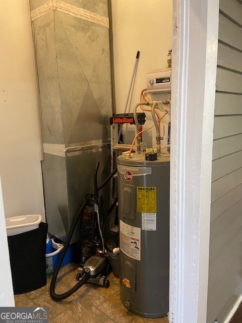 utility room with water heater