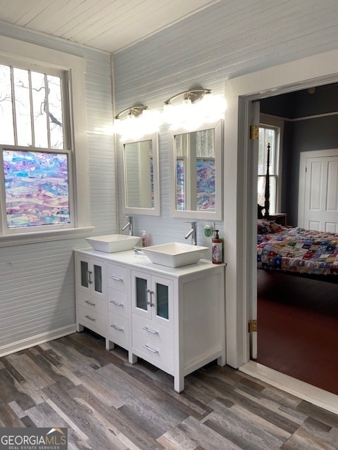 bathroom featuring crown molding, vanity, hardwood / wood-style flooring, and wood ceiling