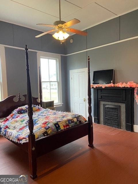 bedroom with hardwood / wood-style flooring and ceiling fan