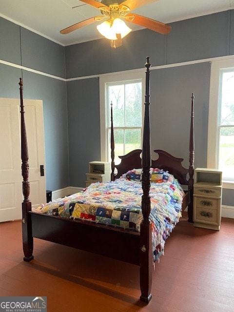 bedroom featuring hardwood / wood-style floors and ceiling fan