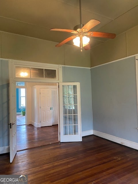 entrance foyer featuring dark hardwood / wood-style flooring and ceiling fan