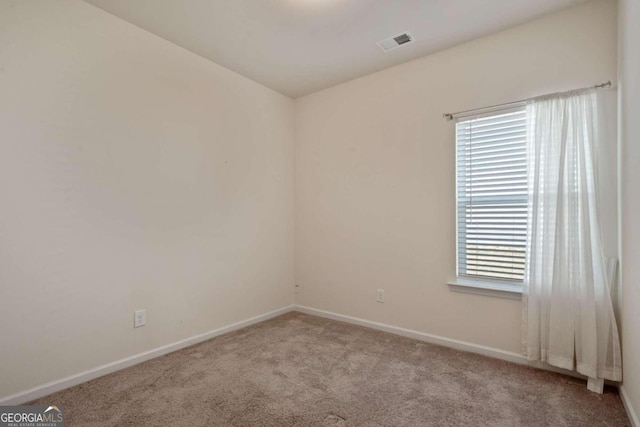 view of carpeted spare room