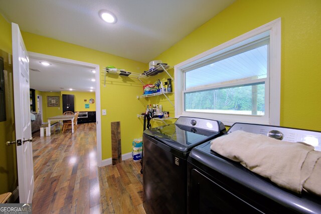 laundry area featuring dark hardwood / wood-style flooring and independent washer and dryer