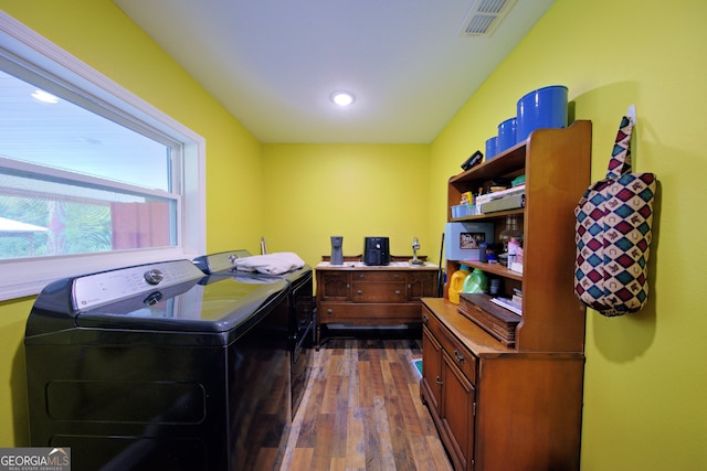 washroom with dark hardwood / wood-style flooring and washer and dryer