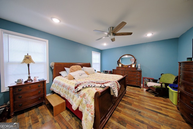 bedroom featuring dark wood-type flooring and ceiling fan