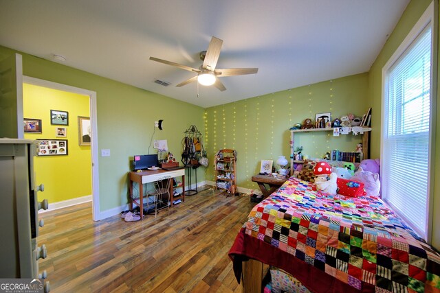 bedroom featuring hardwood / wood-style flooring and ceiling fan