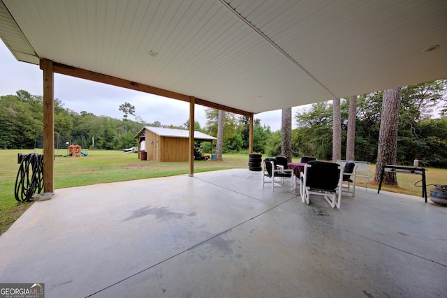 view of patio featuring a shed