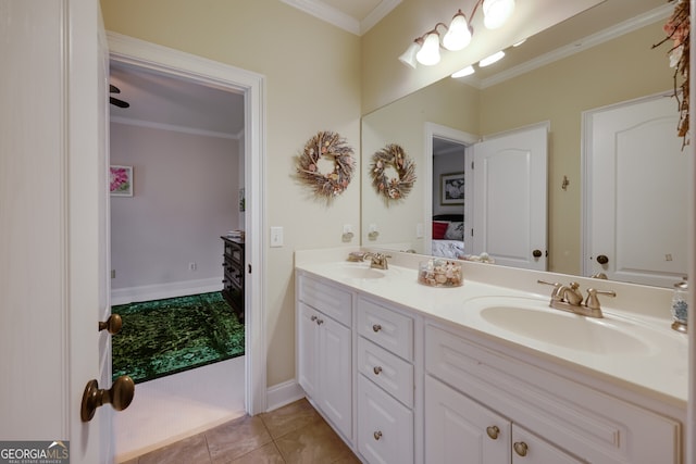 bathroom featuring crown molding, vanity, and tile patterned floors