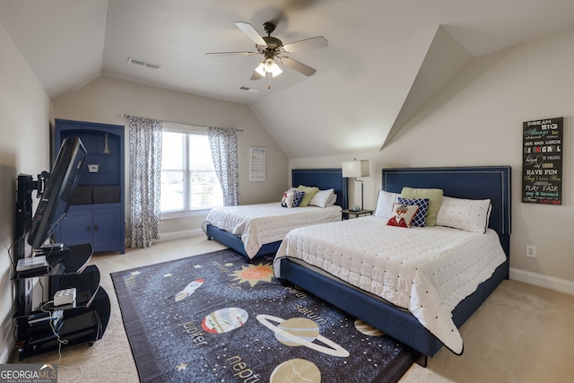 carpeted bedroom with lofted ceiling and ceiling fan