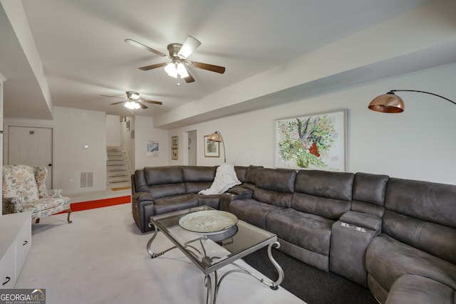 living room with ceiling fan and light colored carpet