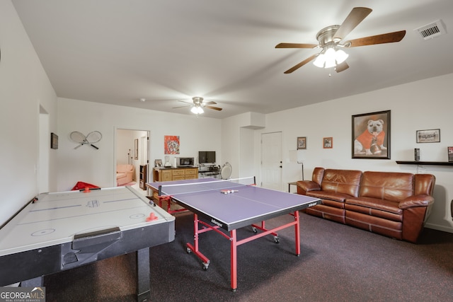 playroom with ceiling fan and carpet