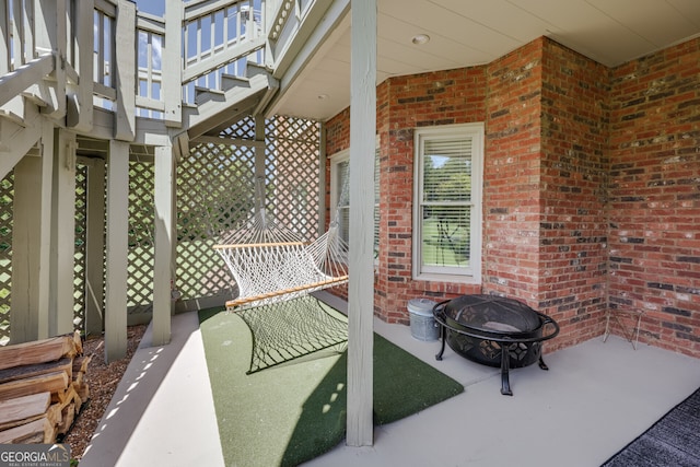 view of patio / terrace with an outdoor fire pit