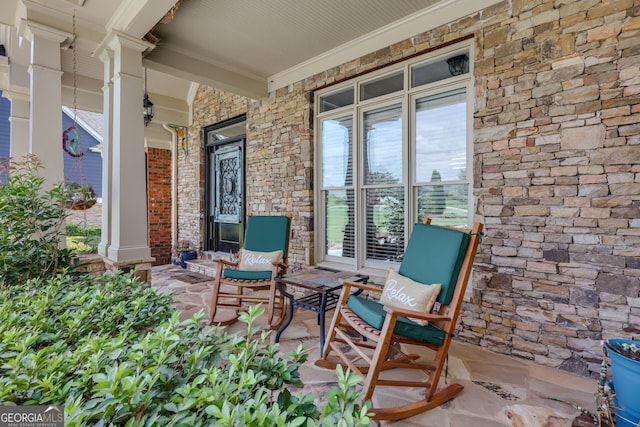 view of patio featuring a porch