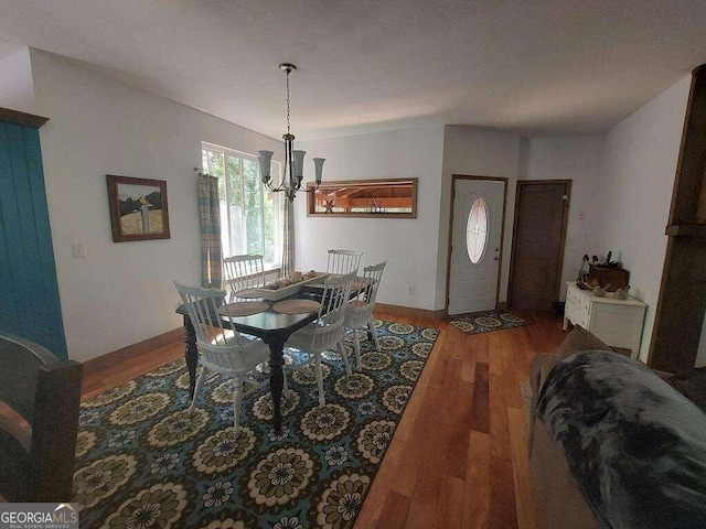 dining area featuring a chandelier and hardwood / wood-style flooring