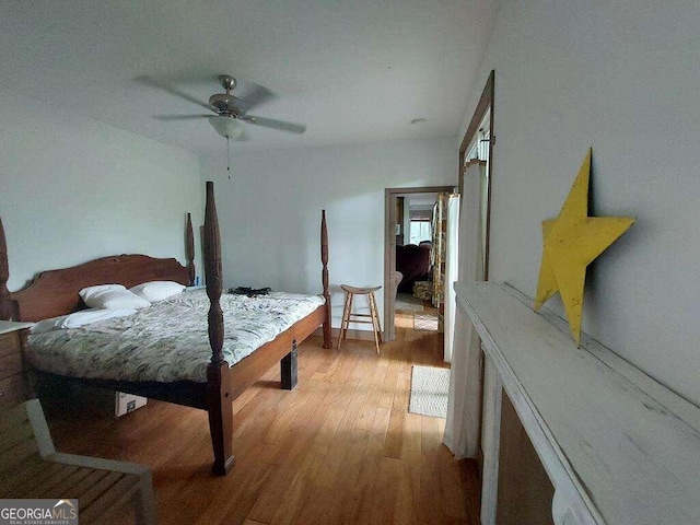 bedroom with light wood-type flooring and ceiling fan