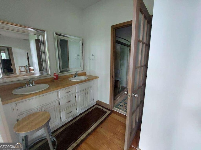 bathroom featuring hardwood / wood-style floors and vanity