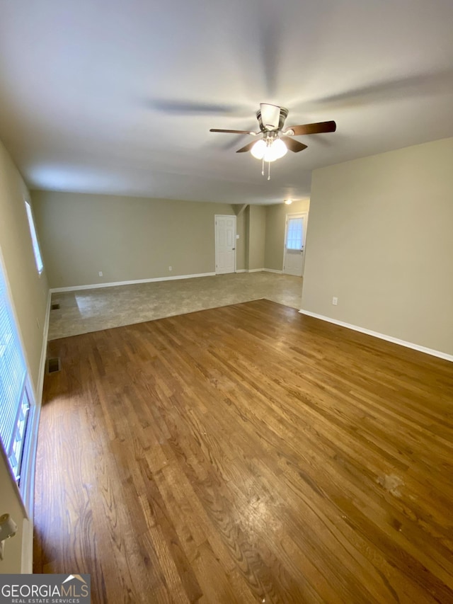 empty room featuring hardwood / wood-style flooring and ceiling fan