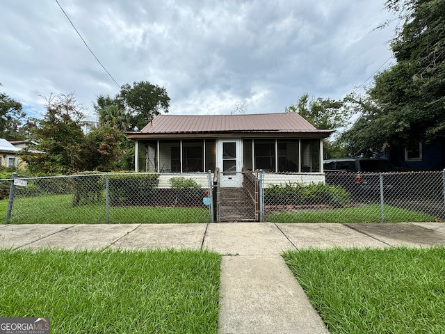 bungalow-style house with a front yard