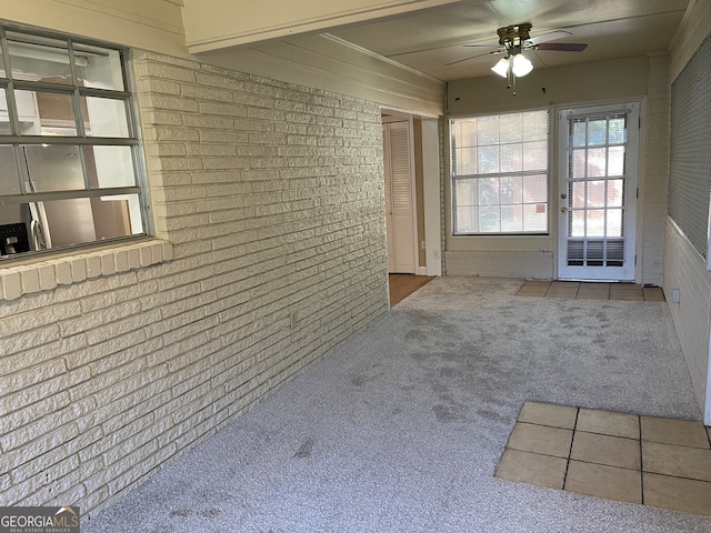 interior space featuring ceiling fan