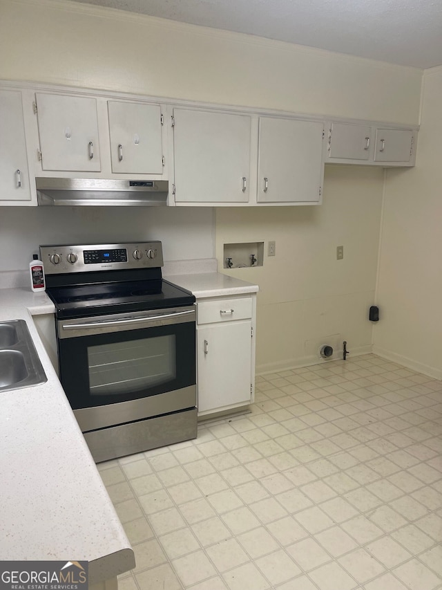 kitchen featuring stainless steel electric stove and white cabinets