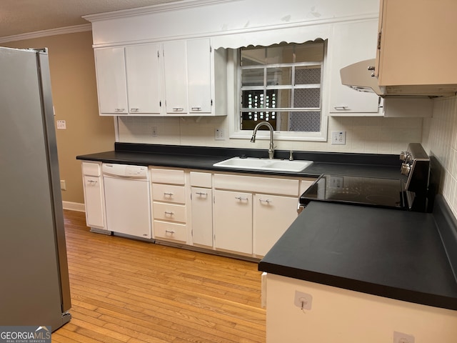 kitchen with range, dishwasher, stainless steel refrigerator, sink, and white cabinets