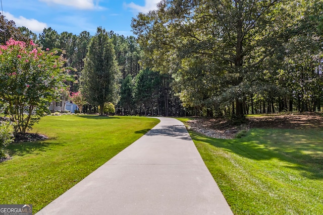 surrounding community featuring a lawn