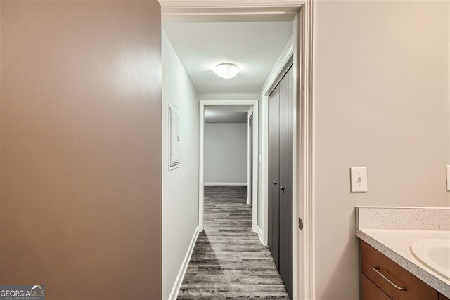 interior space with dark hardwood / wood-style flooring and sink