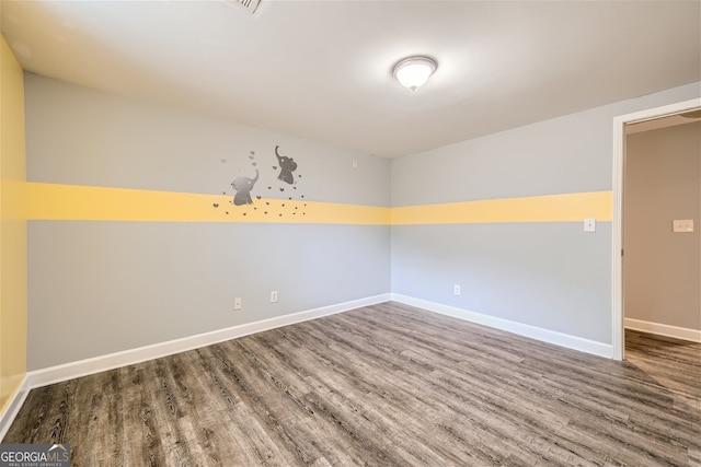 spare room featuring hardwood / wood-style flooring