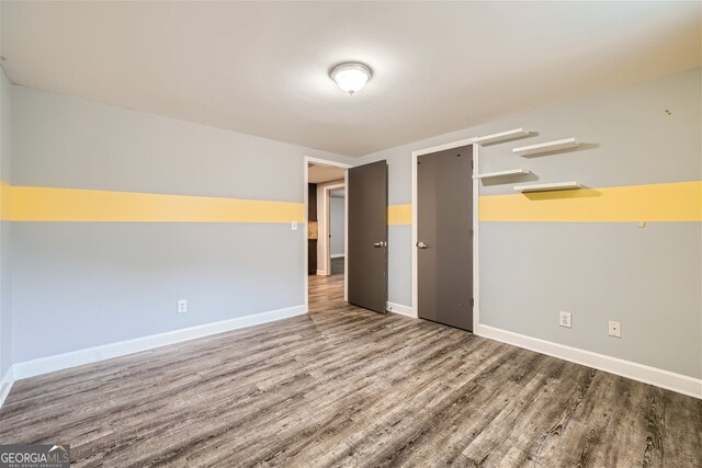 spare room featuring hardwood / wood-style flooring