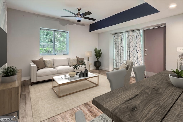 living room with light wood-type flooring and ceiling fan