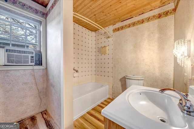 bathroom with hardwood / wood-style floors, vanity, shower / tub combination, and wooden ceiling