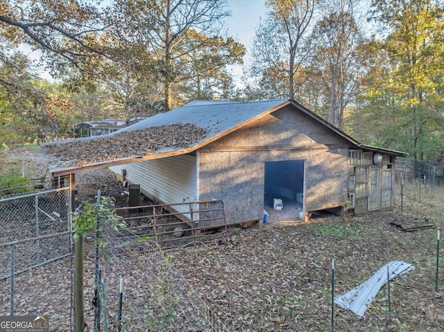 view of home's exterior with an outdoor structure