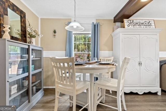 826 Shagbark Pointe Dr, Sparta, GA 31087 - dining area with wood finished floors and a wainscoted wall
