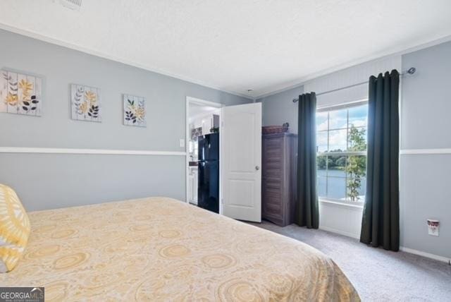 826 Shagbark Pointe Dr, Sparta, GA 31087 - carpeted bedroom featuring freestanding refrigerator and baseboards