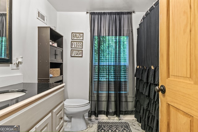 bathroom with vanity and toilet