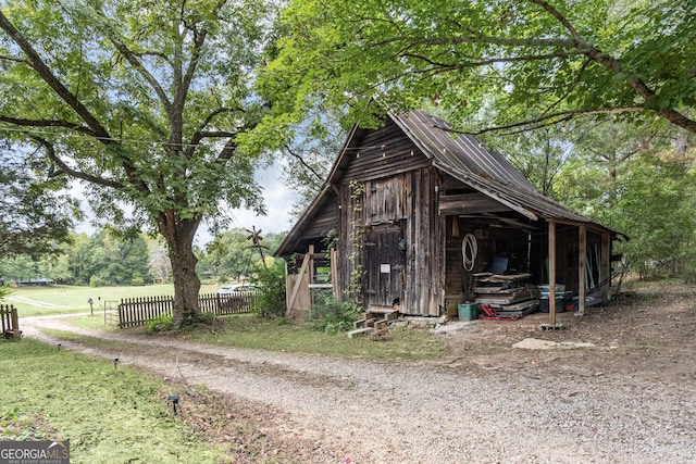 view of home's exterior featuring an outdoor structure