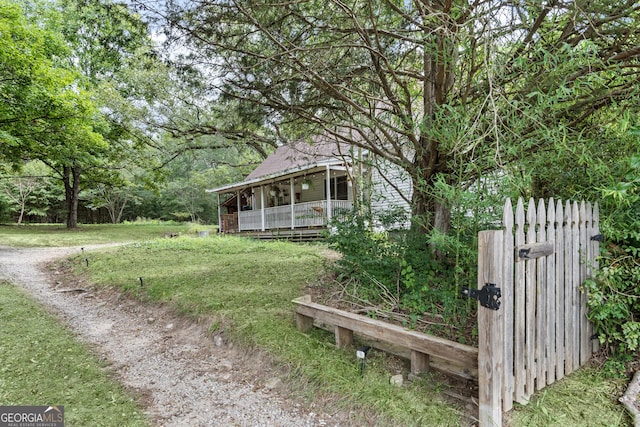 view of yard with covered porch